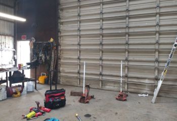 Interior view of newly installed sectional commercial garage door in Lakeway