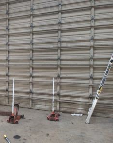 Commercial garage door installation in progress at Lakeway business facility