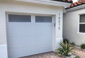 Front view of classic double garage door installation on San Marcos, TX home.