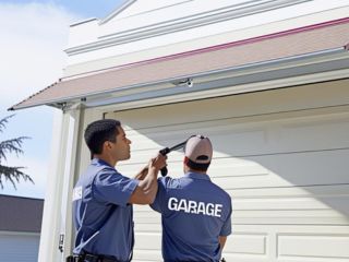 New Garage Door Installation Cedar Park TX Technicians installing a new residential garage door in Cedar Park, Texas