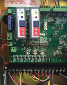 Close-up of Genie garage door opener circuit board during repair