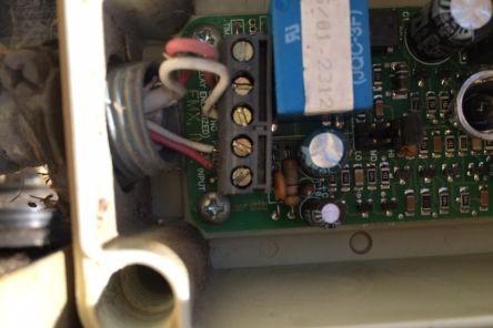 Detailed view of garage door opener control board and wiring
